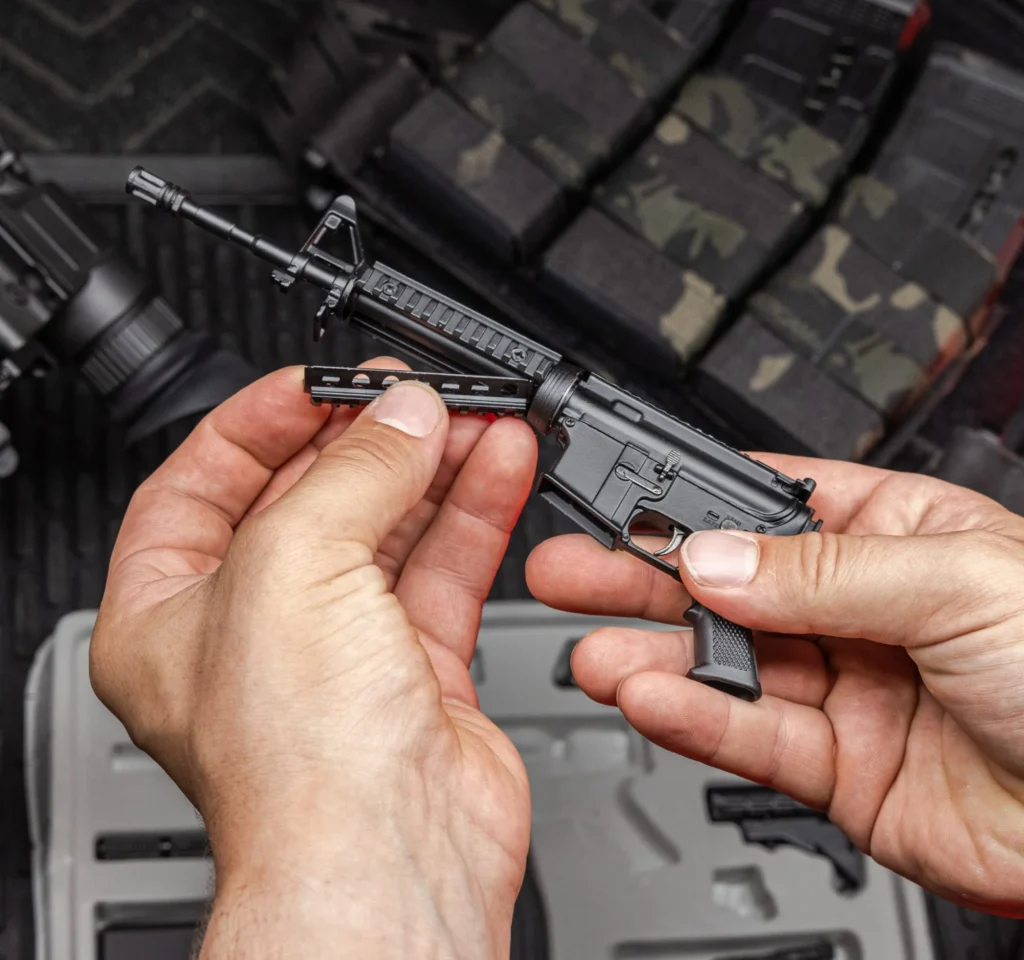 Hands fitting aftermarket parts to a rifle